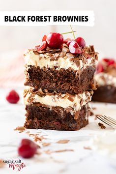 two pieces of black forest brownies stacked on top of each other with cherries