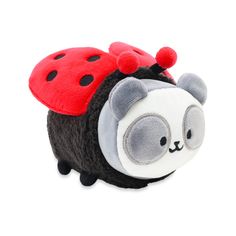 a small stuffed animal with a ladybug on it's back