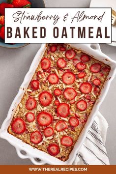 strawberry and almond baked oatmeal in a white dish with strawberries on top