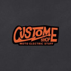 an orange and black sticker with the words custom shop on it's side