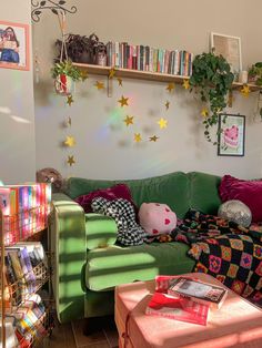 a living room filled with furniture and lots of books