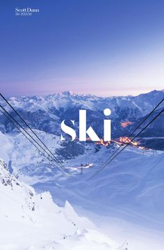 a ski lift with the word ski above it in front of snowy mountains and blue sky