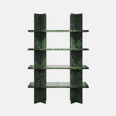 a green bookcase with three shelves on each side and one shelf in the middle