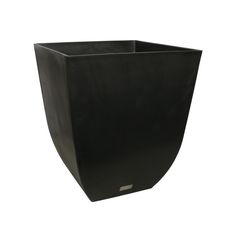 a black planter sitting on top of a white wall