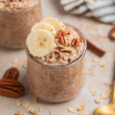 two jars filled with oatmeal and banana slices on top of each other