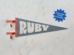 a sign that says ruby hangs on the wall