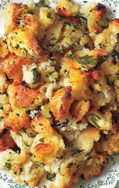 a white plate topped with stuffing and vegetables