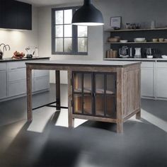 a kitchen with an island in the middle of it