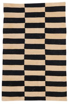 a black and white rug with stripes on it