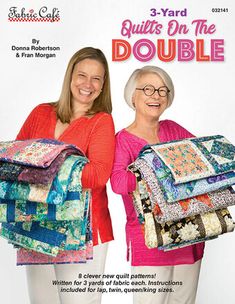 two women standing next to each other holding quilts on the cover of a magazine