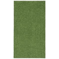 a green area rug on a white background with no one in the room to see it