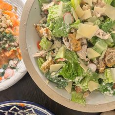 two plates filled with salad next to each other