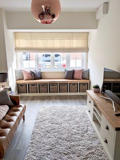 a living room filled with furniture and a flat screen tv