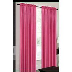 pink curtains hanging in front of a window