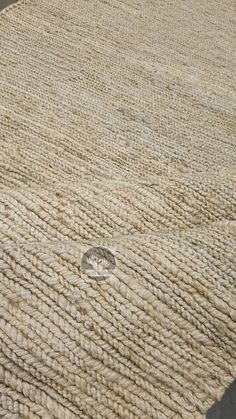 a cat laying on top of a rug