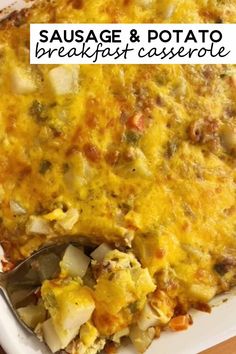 sausage and potato breakfast casserole in a white dish with a serving utensil