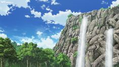 a waterfall in the middle of a lush green forest