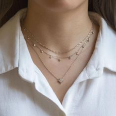 This layered duo consists of two necklaces from the O Collection linked into one set. Our patented connectors let you easily layer necklaces in any order you desire. Wear as a duo or unlink to wear each necklace separately. Designed to mix and match, you can create a look that's uniquely yours. Diamond Cut Lace Chain Italian Diamond Cut Lace chain, width 1.8mm Adjustable chain: 13-16in (33-40cm), 15-18in (38-46cm) Starburst Necklace Pendant: Height 11mm x Width 11mm Adjustable chain: 15-17in (38 3 Layer Necklace, Three Necklaces, Starburst Necklace, Pretty Jewelry Necklaces, Layered Choker Necklace, Studded Necklace, Celestial Necklace, Layered Necklace Set, Necklace Unique