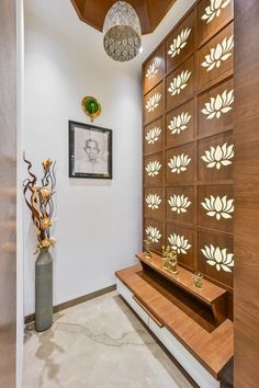 an entry way with wooden paneling and decorative artwork on the wall