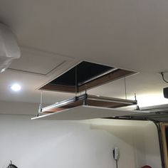 two suspended lights in the middle of a room