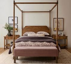 a bedroom with a canopy bed and wooden furniture