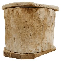 a wooden stool made out of logs on a white background for use as a planter