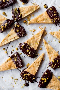 chocolate and pistachio triangles on parchment paper