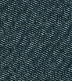 dark blue denim fabric textured with small white dots on the back and sides, closeup