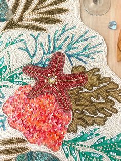 a table topped with lots of different types of beads