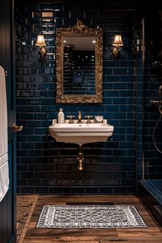 a bathroom that has a sink and mirror on the wall in front of blue tiles