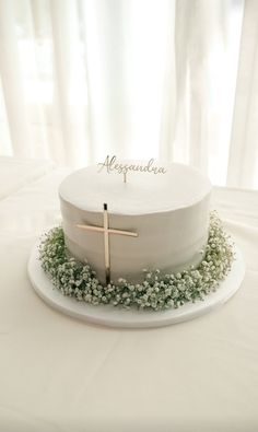 a white cake with a cross on top