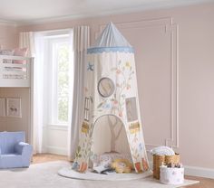 a child's bedroom with a teepee tent bed