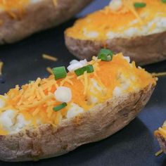 baked potatoes topped with cheese and green onions