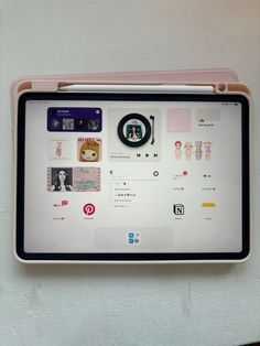 an electronic device mounted to the side of a white wall with stickers on it