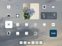 an image of a tablet screen with various app icons on the screen and sky in the background