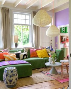 a living room filled with lots of colorful furniture