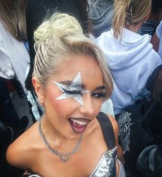 a woman with her face painted like a star