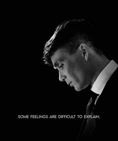 a man in a suit and tie looking down at his cell phone with the caption, some feelings are difficult to explain