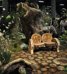 a wooden bench sitting next to a tree stump