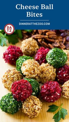 cheese ball bites with raspberries and pecans in the middle on a cutting board