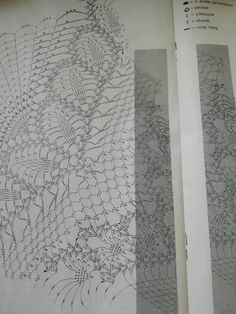 an open book with drawings on it and two pages showing the same pattern as each other