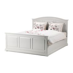 a white bed with two pillows on top of the headboard and foot board, in front of a white background