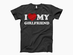 Express your love with the "I Love My Girlfriend" shirt, a perfect way to show your appreciation for the special woman in your life. This cute girlfriend tee combines style and sentiment, making it a thoughtful gift for your girlfriend on any occasion. Crafted from soft, high-quality fabric, it offers both comfort and durability for everyday wear. Whether it's for a romantic date, a casual outing, or simply to let her know she's the best girlfriend ever, this shirt makes a heartfelt statement. With its playful design, this fun girlfriend shirt is not only trendy but also a unique couple's gift that she'll cherish. Celebrate your loving girlfriend and wear your heart on your sleeve with this adorable tee! G A R M E N T S ∙ F E A T U R E S : * UNISEX TEE SHORT SLEEVE. * Uniquely soft fabrica Matching Boyfriend, Funny Boyfriend, Best Girlfriend Ever, Love You Boyfriend, Girlfriend Shirt, Love My Girlfriend, I Love My Boyfriend, Boyfriend Outfit, Girlfriend Shirts