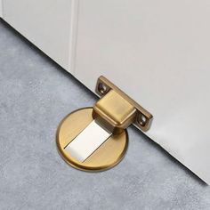 CUTICATE Floor Suction Door Stopper Adhesive or Screw Mount Heavy Duty Wall Protector Yellow Bronze.Windproof floor suction door stopper, keeps the door to open and prevents the door from collision, noise canceling and shock absorbent, and protects the door and wall from damage and scratches.The door stop holder is made of premium zinc alloy material, wear resistant, sturdy and has a long service life.The door is suitable for door bottom height of 5.5-15mm.The door stopper for the bottom of door Cute Door Stoppers, Office Bathroom, Door Stopper, Metal Door, Door Stop, Wooden Doors, Guest House, Glass Door, Zinc Alloy