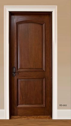 a wooden door is shown in an empty room