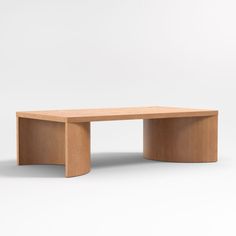 a wooden table sitting on top of a white floor