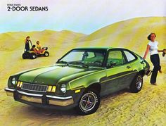 an advertisement for a car in the desert with two women standing next to it and one man pushing a buggy