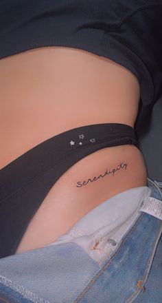 a woman's stomach with the word sandy written on her lower back side belly