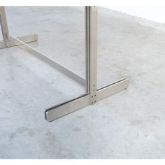 an image of a metal table legs on concrete floor