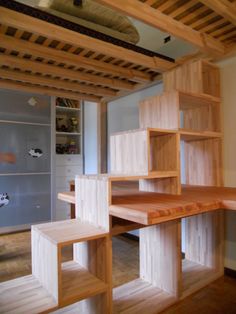 an unfinished room with shelves and shelving in it